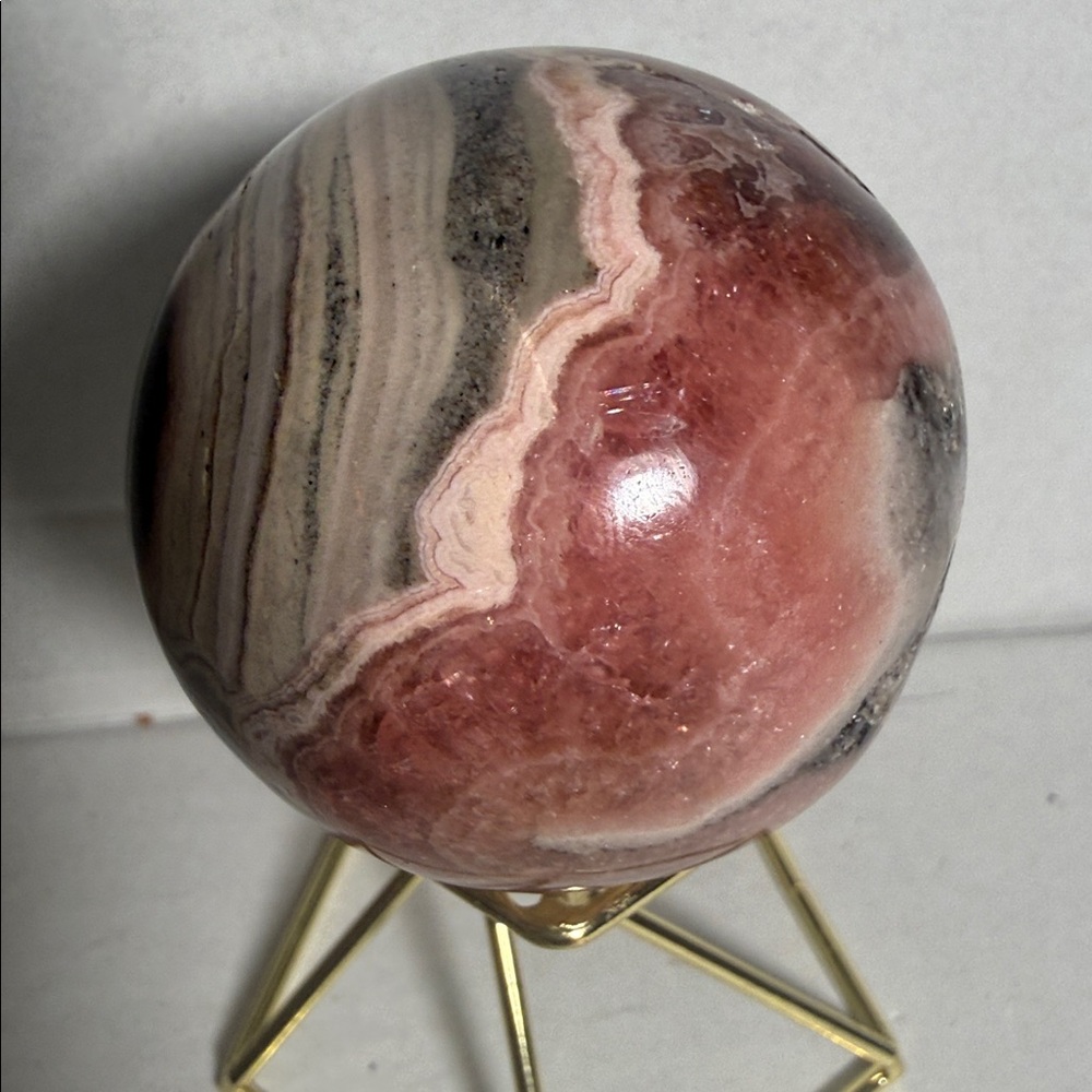 Rare Rhodochrosite sphere 48 mm
 185g  beautiful flowing banding w/ deep pink